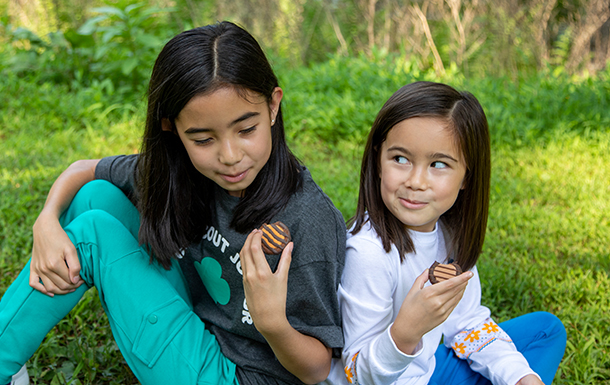 girl scouts eating cookies